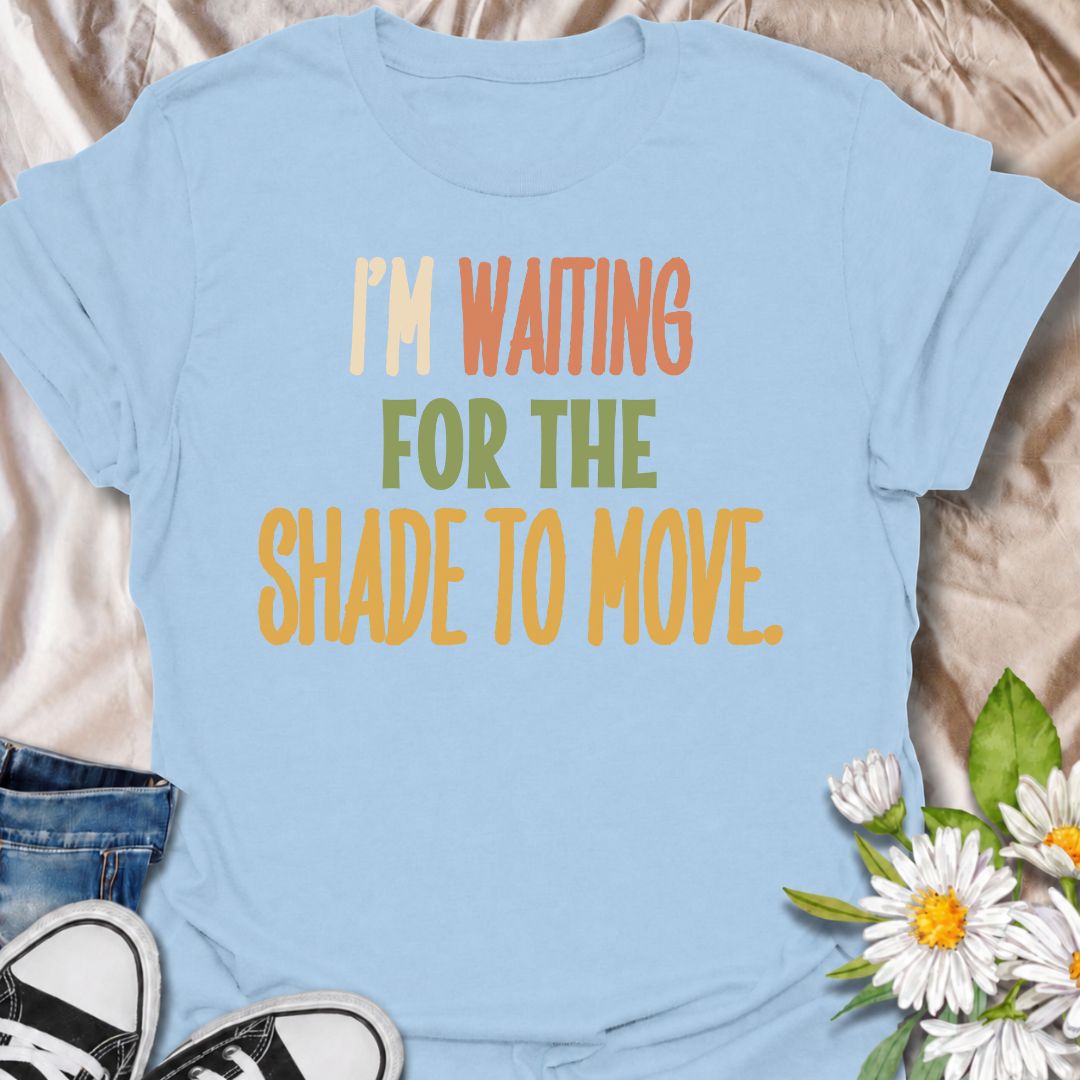 A funny gardening T-shirt for anyone who knows a “quick job” in the garden can turn into a full afternoon outside. The phrase “I’m Waiting for the Shade to Move” captures that familiar gardener habit of working around the sun instead of calling it a day. Its bold retro typography keeps the design simple, readable, and easy to wear. It makes a great gift for backyard gardeners, flower growers, vegetable gardeners, and anyone who plans garden jobs around the heat. Ideal for garden days, nursery trips, farmers