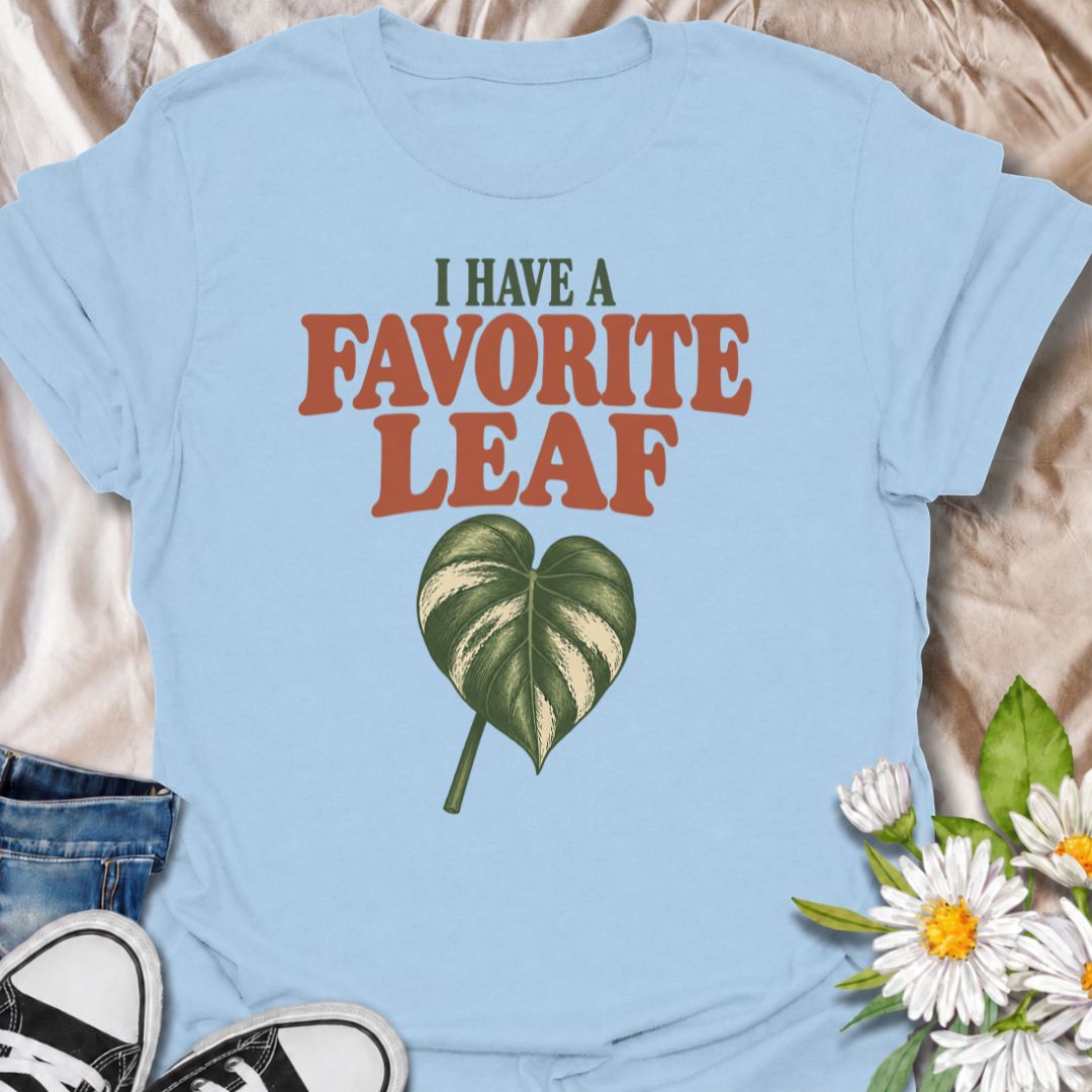 A playful plant T-shirt for anyone who definitely has a favorite leaf and is not afraid to admit it. The phrase “I Have a Favorite Leaf” pairs with a single variegated leaf for a simple, plant-lover design with just the right amount of personality. It is perfect for houseplant collectors, variegated plant fans, indoor gardeners, and anyone who notices every new leaf as it unfurls. The clean layout makes it easy to wear while still feeling distinctly niche. A great gift for plant parents, pothos lovers, phil