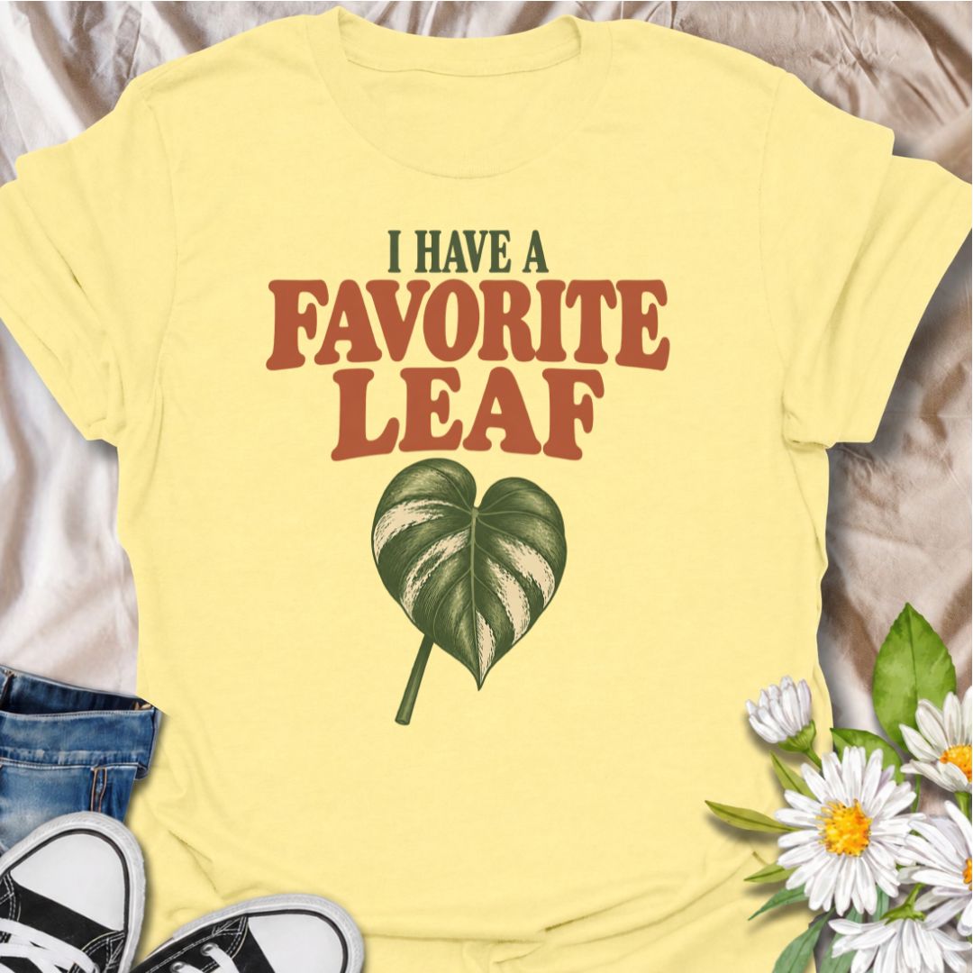 A playful plant T-shirt for anyone who definitely has a favorite leaf and is not afraid to admit it. The phrase “I Have a Favorite Leaf” pairs with a single variegated leaf for a simple, plant-lover design with just the right amount of personality. It is perfect for houseplant collectors, variegated plant fans, indoor gardeners, and anyone who notices every new leaf as it unfurls. The clean layout makes it easy to wear while still feeling distinctly niche. A great gift for plant parents, pothos lovers, phil