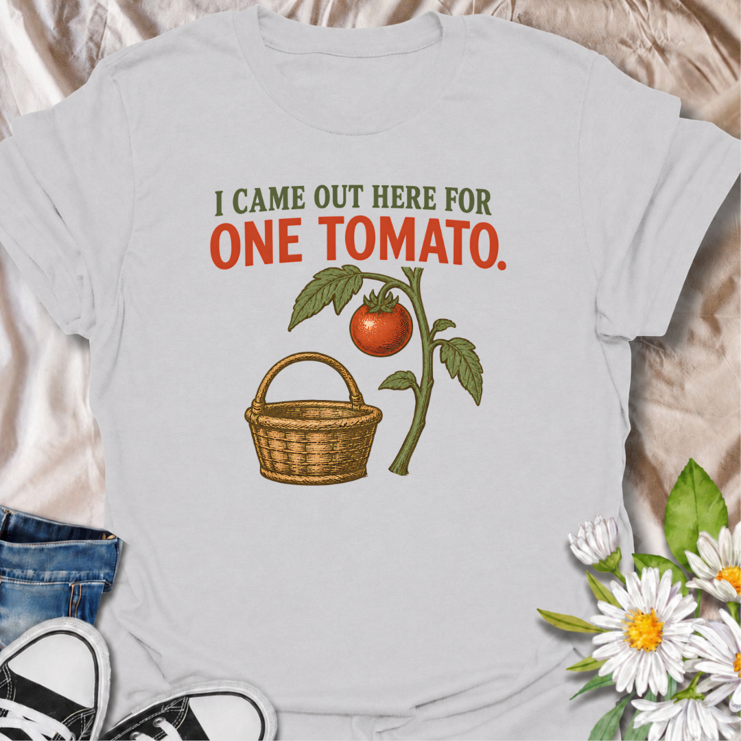 A funny gardening T-shirt for anyone who heads outside for one tomato and somehow gets distracted by everything else in the garden. The phrase “I Came Out Here for One Tomato” captures that familiar backyard-gardener moment with simple, relatable humor. Featuring a ripe tomato on the vine and a vintage-style harvest basket, the design feels warm, rustic, and easy to wear. It makes a great gift for tomato growers, vegetable gardeners, and anyone who spends harvest season wandering around the garden. Ideal fo