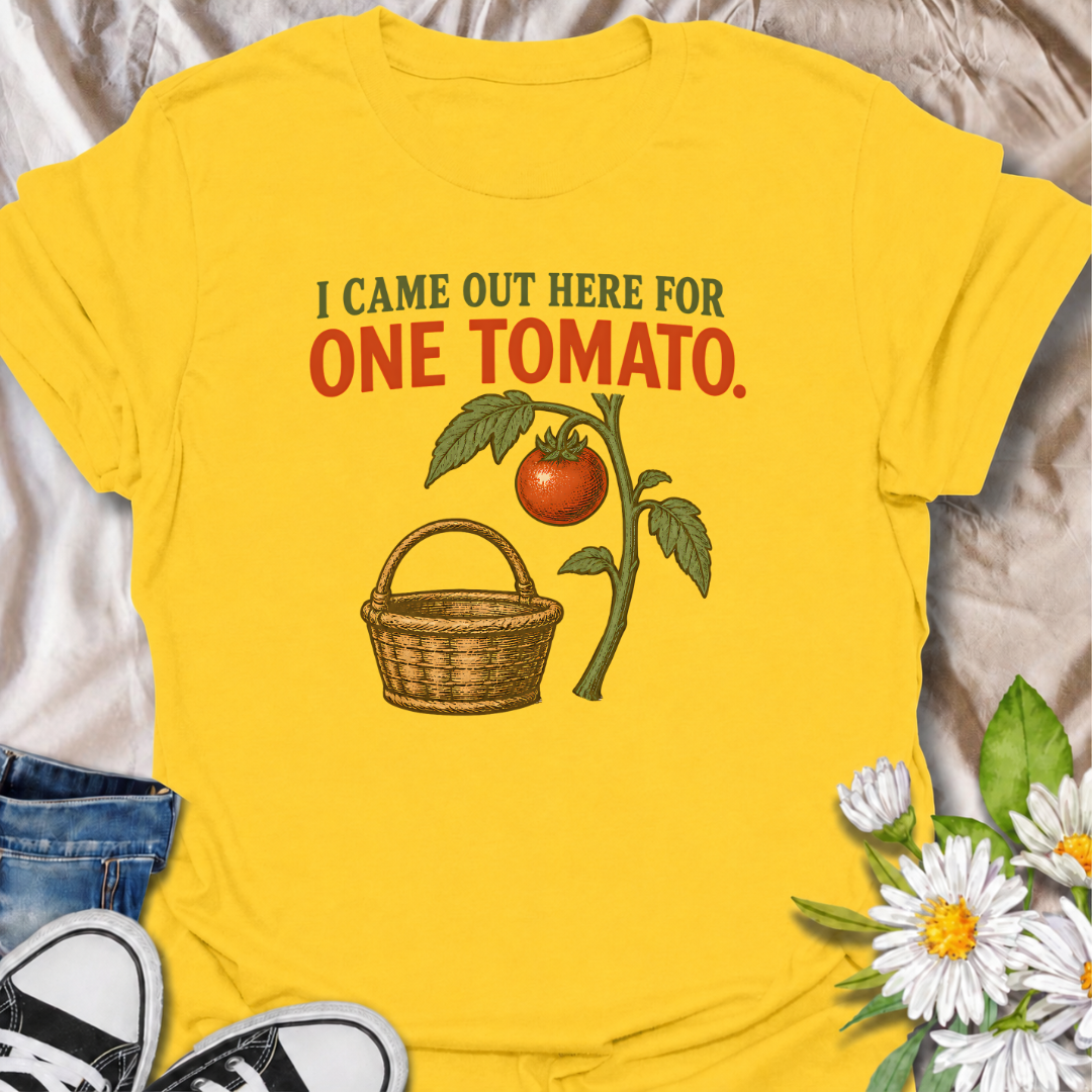 A funny gardening T-shirt for anyone who heads outside for one tomato and somehow gets distracted by everything else in the garden. The phrase “I Came Out Here for One Tomato” captures that familiar backyard-gardener moment with simple, relatable humor. Featuring a ripe tomato on the vine and a vintage-style harvest basket, the design feels warm, rustic, and easy to wear. It makes a great gift for tomato growers, vegetable gardeners, and anyone who spends harvest season wandering around the garden. Ideal fo