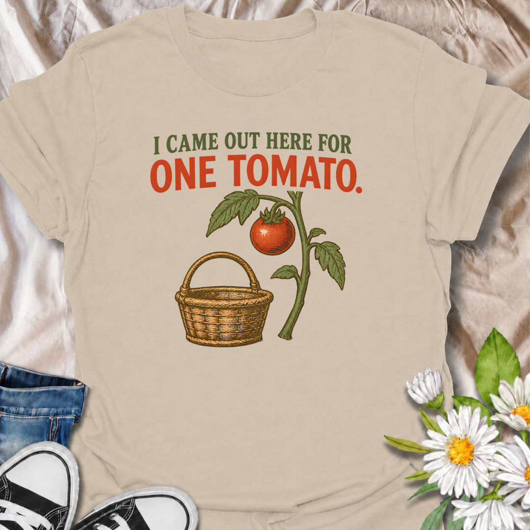 A funny gardening T-shirt for anyone who heads outside for one tomato and somehow gets distracted by everything else in the garden. The phrase “I Came Out Here for One Tomato” captures that familiar backyard-gardener moment with simple, relatable humor. Featuring a ripe tomato on the vine and a vintage-style harvest basket, the design feels warm, rustic, and easy to wear. It makes a great gift for tomato growers, vegetable gardeners, and anyone who spends harvest season wandering around the garden. Ideal fo