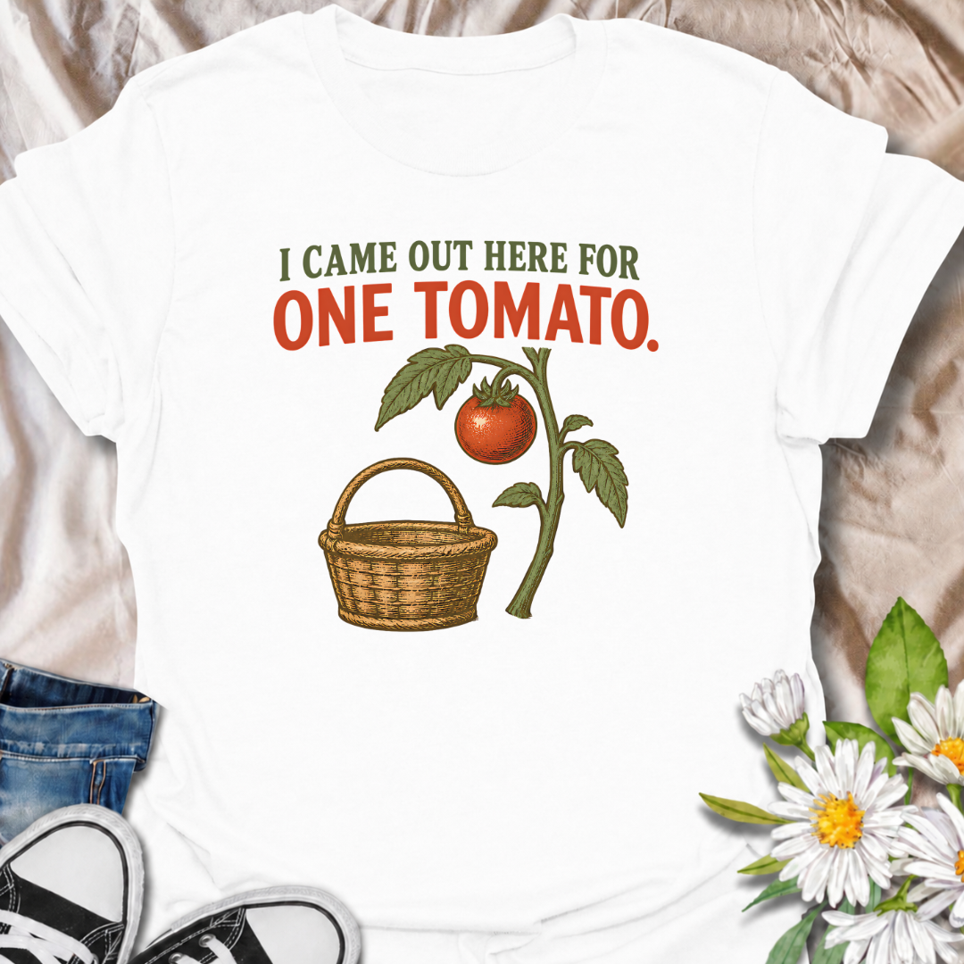 A funny gardening T-shirt for anyone who heads outside for one tomato and somehow gets distracted by everything else in the garden. The phrase “I Came Out Here for One Tomato” captures that familiar backyard-gardener moment with simple, relatable humor. Featuring a ripe tomato on the vine and a vintage-style harvest basket, the design feels warm, rustic, and easy to wear. It makes a great gift for tomato growers, vegetable gardeners, and anyone who spends harvest season wandering around the garden. Ideal fo