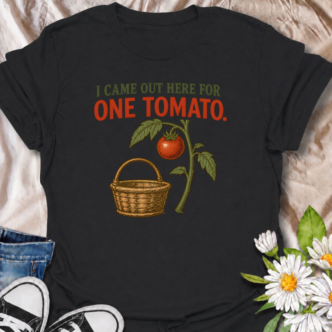 A funny gardening T-shirt for anyone who heads outside for one tomato and somehow gets distracted by everything else in the garden. The phrase “I Came Out Here for One Tomato” captures that familiar backyard-gardener moment with simple, relatable humor. Featuring a ripe tomato on the vine and a vintage-style harvest basket, the design feels warm, rustic, and easy to wear. It makes a great gift for tomato growers, vegetable gardeners, and anyone who spends harvest season wandering around the garden. Ideal fo