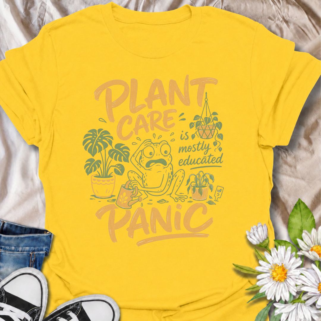 A funny plant T-shirt for anyone who has read all the care guides and still panics when a leaf starts looking slightly different. The phrase “Plant Care Is Mostly Educated Panic” perfectly captures the reality of houseplant ownership with playful, relatable humor. Featuring a worried frog surrounded by potted plants, a watering can, and plant-care chaos, this design is ideal for plant parents, indoor gardeners, and houseplant collectors. It makes a great gift for anyone who checks the soil twice, Googles ye