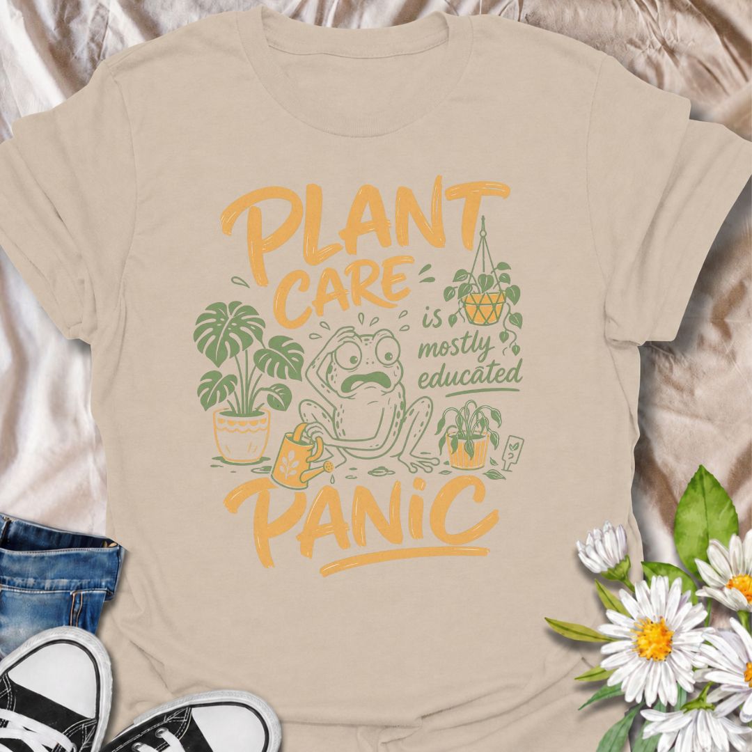 A funny plant T-shirt for anyone who has read all the care guides and still panics when a leaf starts looking slightly different. The phrase “Plant Care Is Mostly Educated Panic” perfectly captures the reality of houseplant ownership with playful, relatable humor. Featuring a worried frog surrounded by potted plants, a watering can, and plant-care chaos, this design is ideal for plant parents, indoor gardeners, and houseplant collectors. It makes a great gift for anyone who checks the soil twice, Googles ye