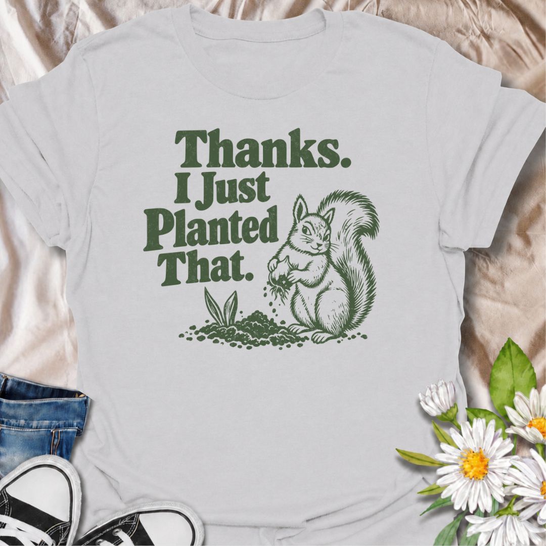 A funny gardening T-shirt for anyone who has ever discovered that a squirrel has been “helping” with the planting. The phrase “Thanks. I Just Planted That.” pairs perfectly with a cheeky squirrel digging around a fresh planting spot for dry, relatable garden humor. It is ideal for backyard gardeners, flower growers, vegetable gardeners, and anyone familiar with wildlife undoing their hard work. The retro-style illustration keeps the design playful without feeling overly cute. A great gift for gardeners, squ