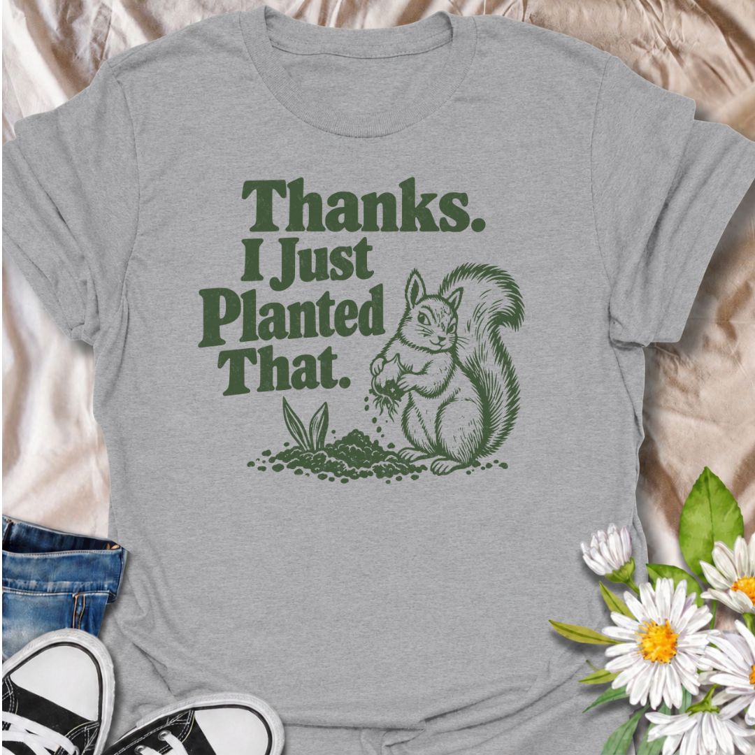 A funny gardening T-shirt for anyone who has ever discovered that a squirrel has been “helping” with the planting. The phrase “Thanks. I Just Planted That.” pairs perfectly with a cheeky squirrel digging around a fresh planting spot for dry, relatable garden humor. It is ideal for backyard gardeners, flower growers, vegetable gardeners, and anyone familiar with wildlife undoing their hard work. The retro-style illustration keeps the design playful without feeling overly cute. A great gift for gardeners, squ