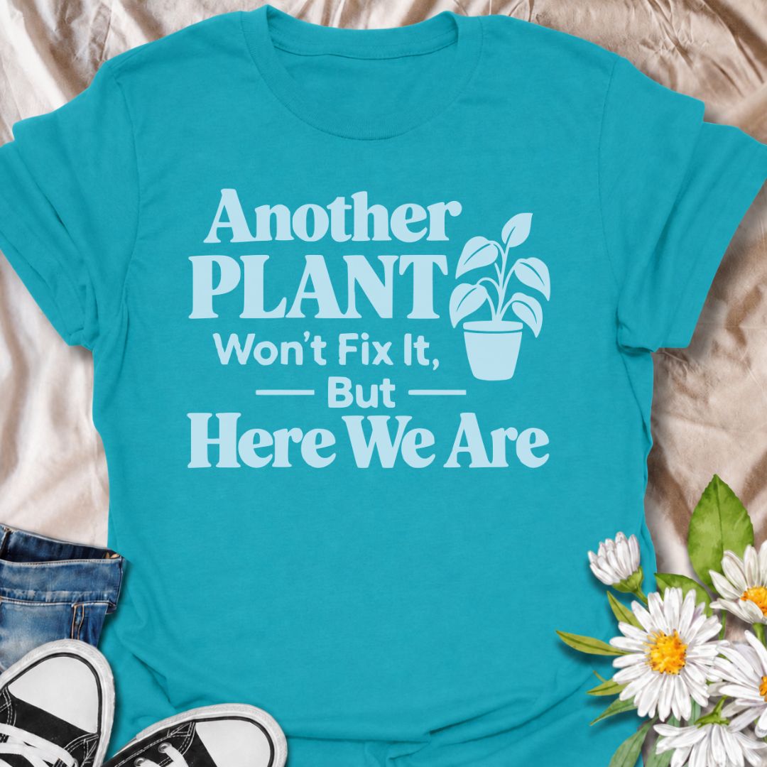 A funny plant T-shirt for anyone who knows buying another houseplant probably will not solve the problem—but does it anyway. The phrase “Another Plant Won’t Fix It, But Here We Are” delivers dry, self-aware humor that plant parents and collectors will instantly understand. Featuring bold typography with a simple potted plant graphic, the design stays clean, readable, and easy to wear. It makes a great gift for houseplant lovers, nursery regulars, and anyone whose indoor jungle keeps growing despite their be