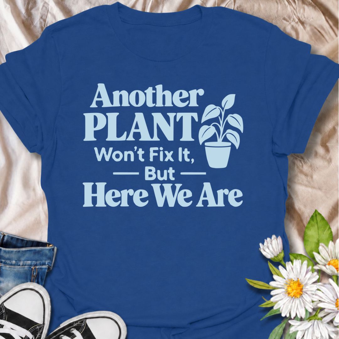 A funny plant T-shirt for anyone who knows buying another houseplant probably will not solve the problem—but does it anyway. The phrase “Another Plant Won’t Fix It, But Here We Are” delivers dry, self-aware humor that plant parents and collectors will instantly understand. Featuring bold typography with a simple potted plant graphic, the design stays clean, readable, and easy to wear. It makes a great gift for houseplant lovers, nursery regulars, and anyone whose indoor jungle keeps growing despite their be