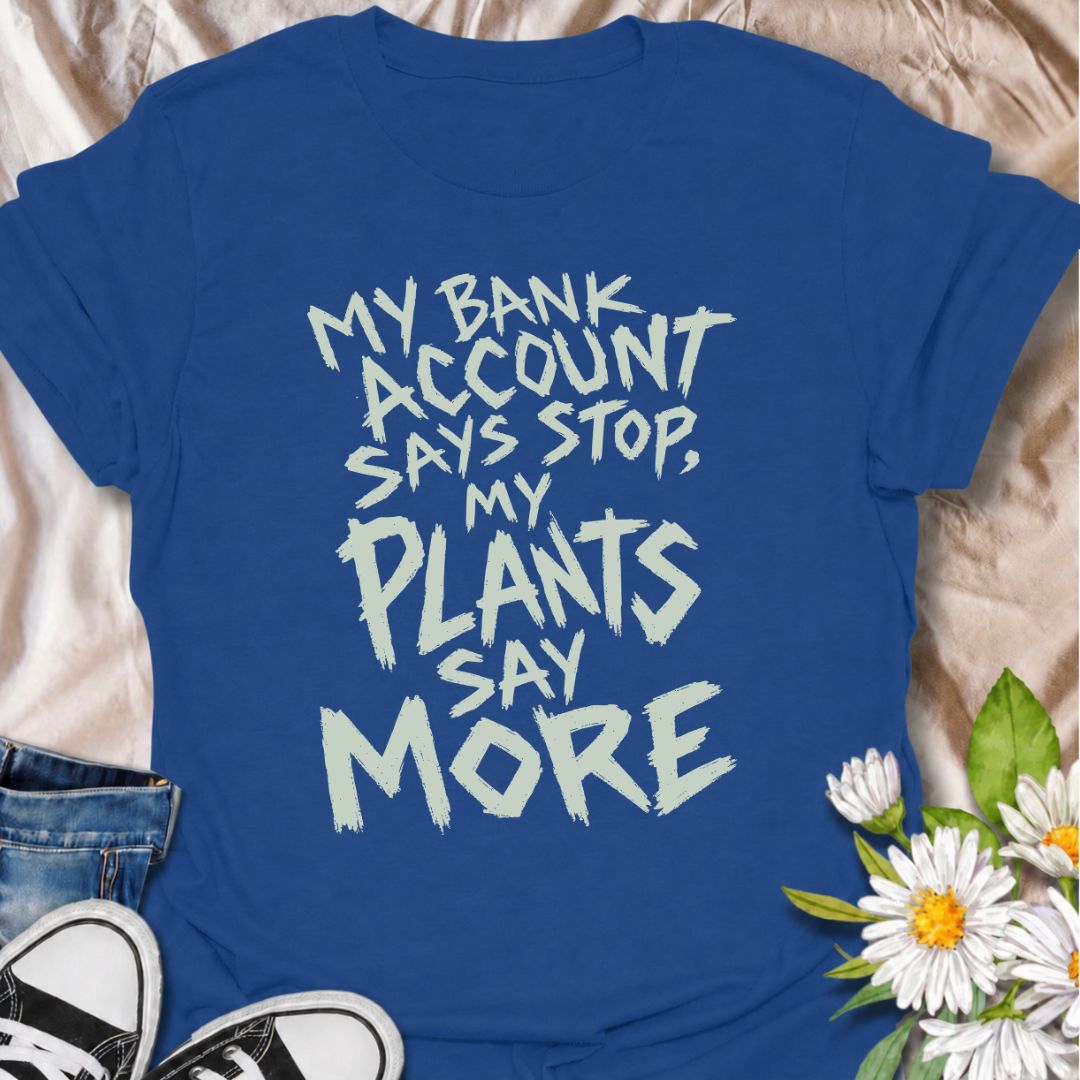 A funny plant T-shirt for anyone whose budget says stop but whose houseplant collection has other ideas. The phrase “My Bank Account Says Stop, My Plants Say More” delivers relatable plant-shopping humor for collectors who can never quite resist another plant. Its bold hand-drawn typography gives the design an expressive, slightly chaotic feel that suits the joke perfectly. It makes a great gift for plant parents, nursery regulars, and anyone whose indoor jungle keeps growing faster than their savings. Perf