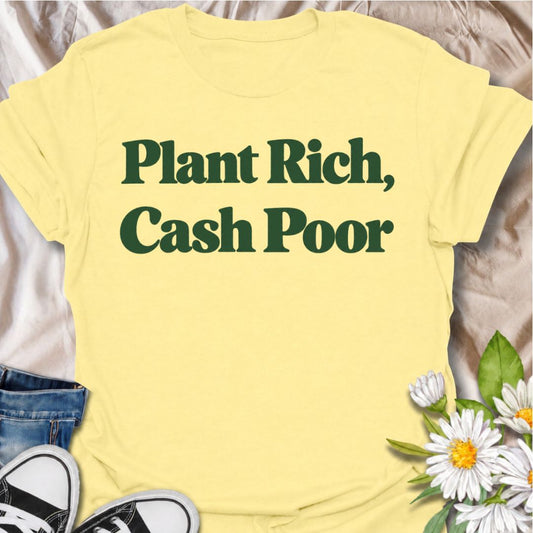 A funny plant T-shirt for anyone whose houseplant collection is thriving even if their bank balance is not. The phrase “Plant Rich, Cash Poor” delivers simple, self-aware humor that plant parents, collectors, and nursery regulars will instantly understand. Its bold retro typography keeps the design clean, readable, and easy to wear. It makes a great gift for houseplant lovers, indoor gardeners, and anyone who keeps spending their spare cash on one more plant. Perfect for nursery trips, plant swaps, garden c