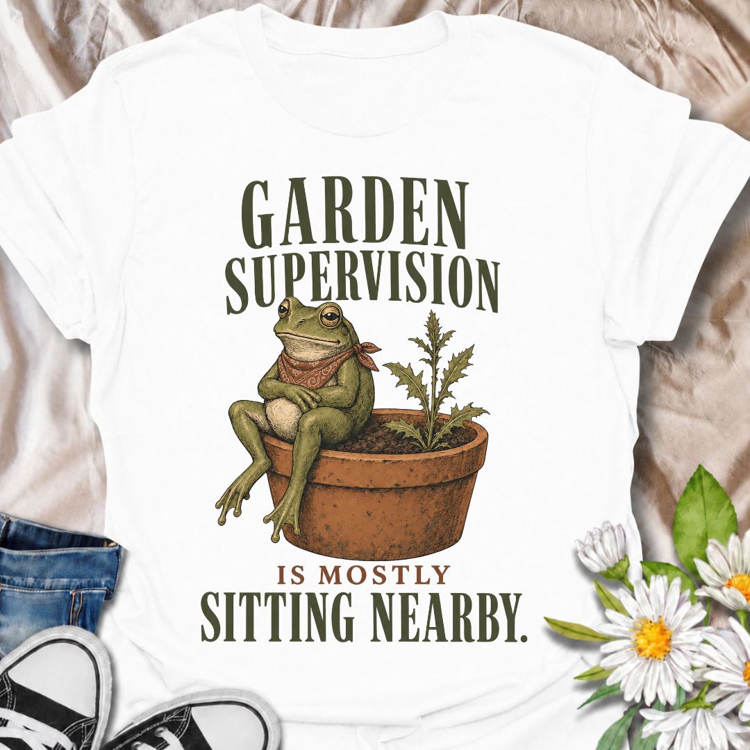 A funny gardening T-shirt for anyone who knows that supervising the garden often means sitting nearby and keeping an eye on things. The phrase “Garden Supervision Is Mostly Sitting Nearby” pairs perfectly with a deadpan frog perched beside a potted weed for dry, character-led garden humor. It is ideal for backyard gardeners, plant lovers, frog fans, and anyone who spends plenty of time simply observing what is growing. The vintage-style illustration gives the design personality while keeping it easy to wear