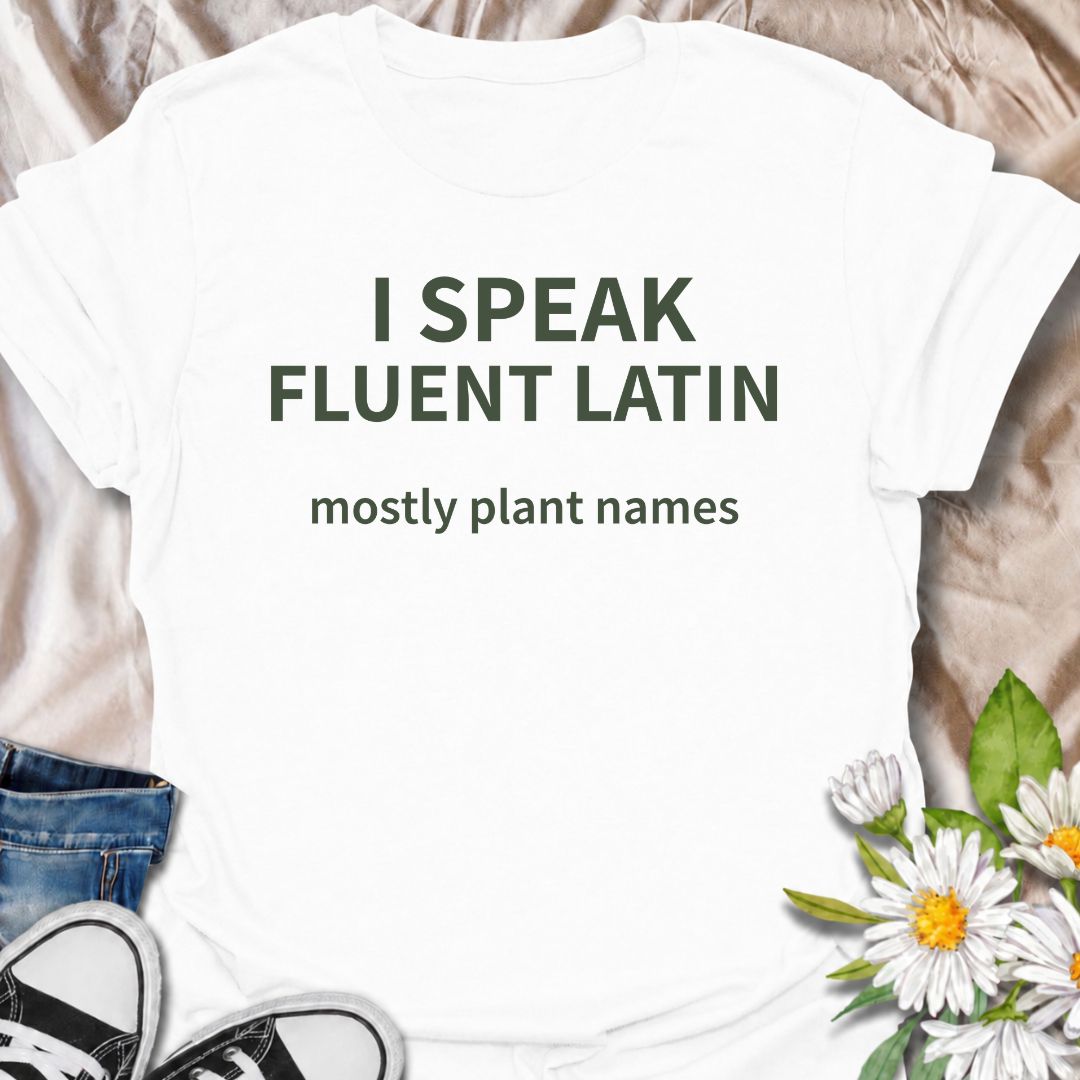 A funny plant T-shirt for gardeners who know more botanical Latin than they ever expected to learn. The phrase “I Speak Fluent Latin — Mostly Plant Names” delivers clever, niche humor for plant lovers, gardeners, and anyone who casually drops scientific plant names into conversation. Its clean typography keeps the design simple, readable, and easy to wear. It makes a great gift for horticulture fans, houseplant collectors, flower gardeners, and serious plant nerds. Perfect for nursery trips, garden centers,