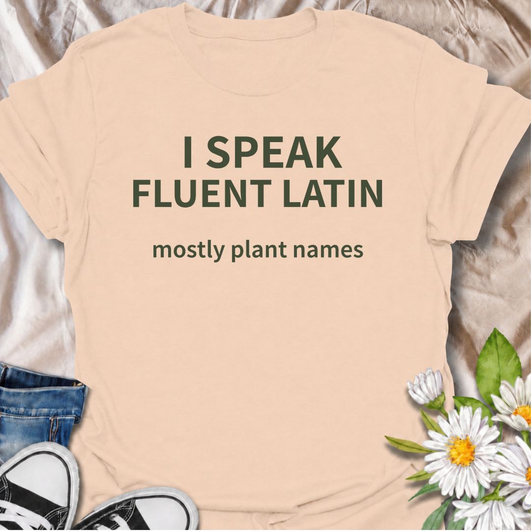 A funny plant T-shirt for gardeners who know more botanical Latin than they ever expected to learn. The phrase “I Speak Fluent Latin — Mostly Plant Names” delivers clever, niche humor for plant lovers, gardeners, and anyone who casually drops scientific plant names into conversation. Its clean typography keeps the design simple, readable, and easy to wear. It makes a great gift for horticulture fans, houseplant collectors, flower gardeners, and serious plant nerds. Perfect for nursery trips, garden centers,