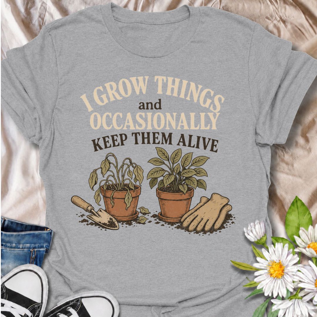 A funny gardening T-shirt for anyone who loves growing plants even when the results are a little unpredictable. The phrase “I Grow Things and Occasionally Keep Them Alive” delivers dry, self-deprecating humor that gardeners and plant lovers will instantly understand. Featuring two potted plants, gardening gloves, and a hand trowel, the design feels relaxed, relatable, and easy to wear. It makes a great gift for backyard gardeners, houseplant fans, and anyone whose green thumb works most of the time. Perfect