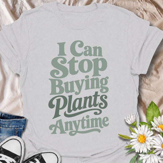 A funny plant T-shirt for anyone who knows they could stop buying houseplants anytime—they just have absolutely no intention of doing so. The phrase “I Can Stop Buying Plants Anytime” delivers dry, self-aware humor that plant parents, collectors, and nursery regulars will instantly understand. Its bold retro typography keeps the design clean, readable, and easy to wear. It makes a great gift for houseplant lovers, indoor gardeners, and anyone whose collection keeps growing one “last” plant at a time. Perfec