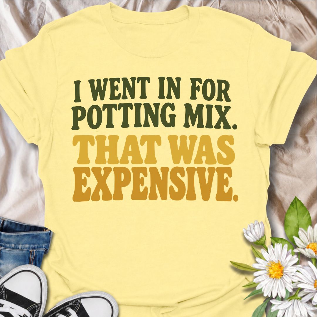 A funny plant T-shirt for anyone who went to the garden center for one bag of potting mix and somehow spent far more than planned. The phrase “I Went In for Potting Mix. That Was Expensive.” delivers dry, relatable humor for plant parents, houseplant collectors, and nursery regulars. Its bold retro typography keeps the design simple, readable, and easy to wear. It makes a great gift for plant lovers who know a “quick trip” for supplies rarely stays cheap. Perfect for nursery visits, garden centers, plant sw