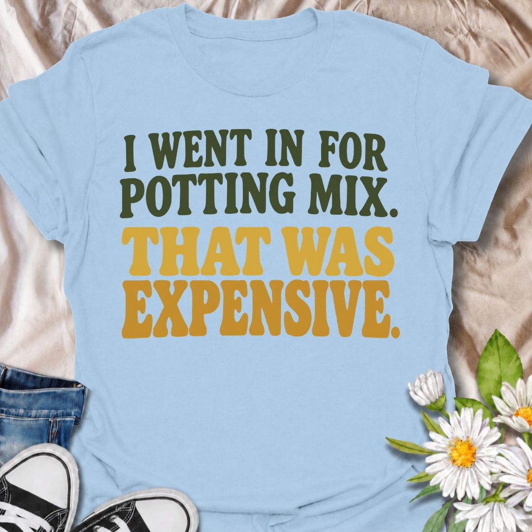 A funny plant T-shirt for anyone who went to the garden center for one bag of potting mix and somehow spent far more than planned. The phrase “I Went In for Potting Mix. That Was Expensive.” delivers dry, relatable humor for plant parents, houseplant collectors, and nursery regulars. Its bold retro typography keeps the design simple, readable, and easy to wear. It makes a great gift for plant lovers who know a “quick trip” for supplies rarely stays cheap. Perfect for nursery visits, garden centers, plant sw