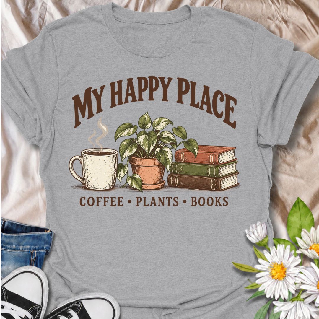 A cozy plant-lover T-shirt for anyone whose happy place includes coffee, houseplants, and a good book. The phrase “My Happy Place — Coffee • Plants • Books” pairs with a warm mug, leafy potted plant, and stacked books for an easygoing lifestyle design. It is perfect for readers, plant parents, indoor gardeners, and coffee lovers who enjoy quiet time at home. The vintage-inspired illustration gives the design a relaxed, thoughtful feel without becoming too busy. A great gift for book lovers, houseplant colle