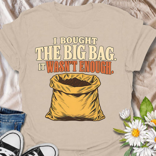 A funny gardening T-shirt for anyone who confidently bought the large bag of soil, compost, or potting mix and still somehow ran out. The phrase “I Bought the Big Bag. It Wasn’t Enough.” captures a familiar gardening problem with simple, relatable humor. Featuring a bold vintage-style sack illustration, the design is perfect for gardeners, plant lovers, and anyone tackling bigger planting jobs than originally planned. It makes a great gift for backyard gardeners, container growers, vegetable gardeners, and 