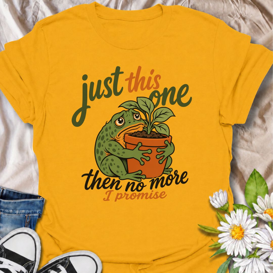 A funny plant T-shirt for anyone who swears every new purchase really will be the last one. The phrase “Just This One, Then No More. I Promise.” pairs with a wide-eyed frog hugging a potted plant for playful, instantly relatable plant-parent humor. It is perfect for houseplant lovers, plant collectors, nursery regulars, and anyone who can never quite resist one more plant. The character-led artwork gives the design plenty of personality while keeping the joke clear and easy to wear. A great gift for plant l