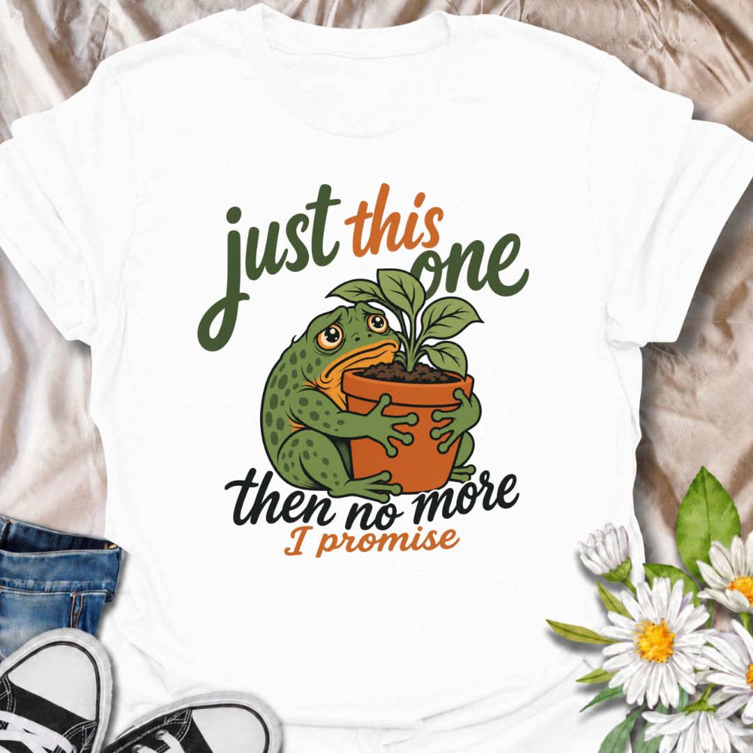 A funny plant T-shirt for anyone who swears every new purchase really will be the last one. The phrase “Just This One, Then No More. I Promise.” pairs with a wide-eyed frog hugging a potted plant for playful, instantly relatable plant-parent humor. It is perfect for houseplant lovers, plant collectors, nursery regulars, and anyone who can never quite resist one more plant. The character-led artwork gives the design plenty of personality while keeping the joke clear and easy to wear. A great gift for plant l