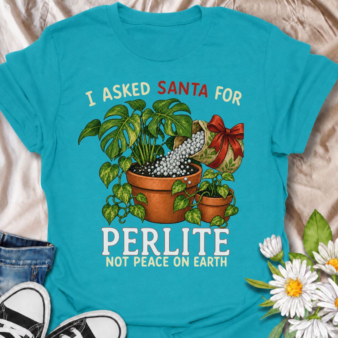A funny Christmas plant T-shirt for houseplant lovers who would rather find gardening supplies under the tree than another ordinary gift. The phrase “I Asked Santa for Perlite, Not Peace on Earth” pairs with lush potted plants and a festive bag of perlite for niche holiday plant humor. It is perfect for plant parents, indoor gardeners, propagation fans, and anyone who takes their potting mix very seriously. The Christmas colors and botanical artwork make it festive without losing the plant-lover personality
