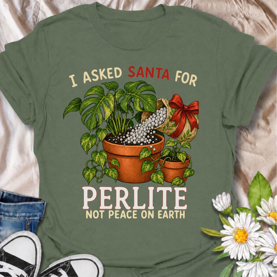 A funny Christmas plant T-shirt for houseplant lovers who would rather find gardening supplies under the tree than another ordinary gift. The phrase “I Asked Santa for Perlite, Not Peace on Earth” pairs with lush potted plants and a festive bag of perlite for niche holiday plant humor. It is perfect for plant parents, indoor gardeners, propagation fans, and anyone who takes their potting mix very seriously. The Christmas colors and botanical artwork make it festive without losing the plant-lover personality