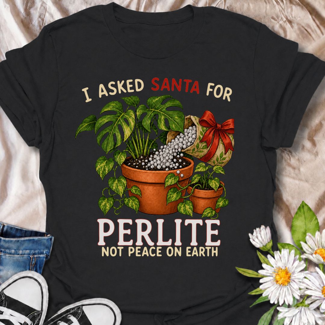 A funny Christmas plant T-shirt for houseplant lovers who would rather find gardening supplies under the tree than another ordinary gift. The phrase “I Asked Santa for Perlite, Not Peace on Earth” pairs with lush potted plants and a festive bag of perlite for niche holiday plant humor. It is perfect for plant parents, indoor gardeners, propagation fans, and anyone who takes their potting mix very seriously. The Christmas colors and botanical artwork make it festive without losing the plant-lover personality