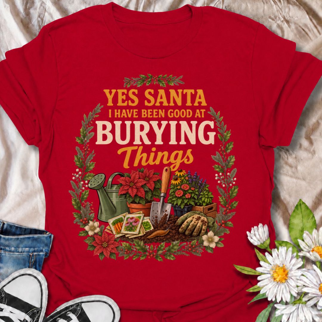 A funny Christmas gardening T-shirt for anyone whose definition of “being good” involves plenty of digging, planting, and burying things in the garden. The phrase “Yes Santa, I Have Been Good at Burying Things” combines festive humor with seed packets, garden tools, flowers, soil, and holiday foliage. It is perfect for backyard gardeners, flower growers, vegetable gardeners, and anyone who spends more time digging than decorating. The detailed vintage-style artwork gives it a full festive look while staying