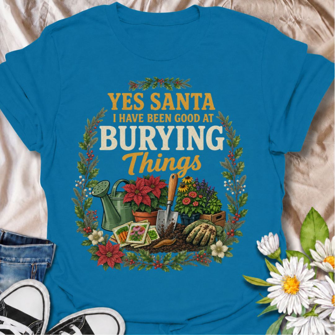 A funny Christmas gardening T-shirt for anyone whose definition of “being good” involves plenty of digging, planting, and burying things in the garden. The phrase “Yes Santa, I Have Been Good at Burying Things” combines festive humor with seed packets, garden tools, flowers, soil, and holiday foliage. It is perfect for backyard gardeners, flower growers, vegetable gardeners, and anyone who spends more time digging than decorating. The detailed vintage-style artwork gives it a full festive look while staying
