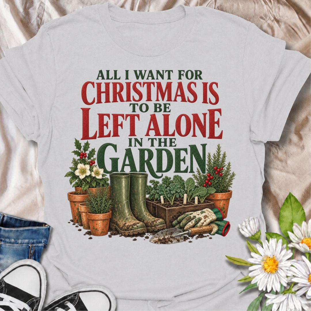 A funny Christmas gardening T-shirt for anyone whose perfect holiday involves escaping outside and being left alone with the plants. The phrase “All I Want for Christmas Is to Be Left Alone in the Garden” pairs with muddy wellies, gloves, a hand trowel, herbs, and festive holly for a design made especially for real gardeners. It is perfect for backyard gardeners, flower growers, vegetable gardeners, and anyone who would rather spend Christmas pottering outside than making small talk indoors. The vintage-sty