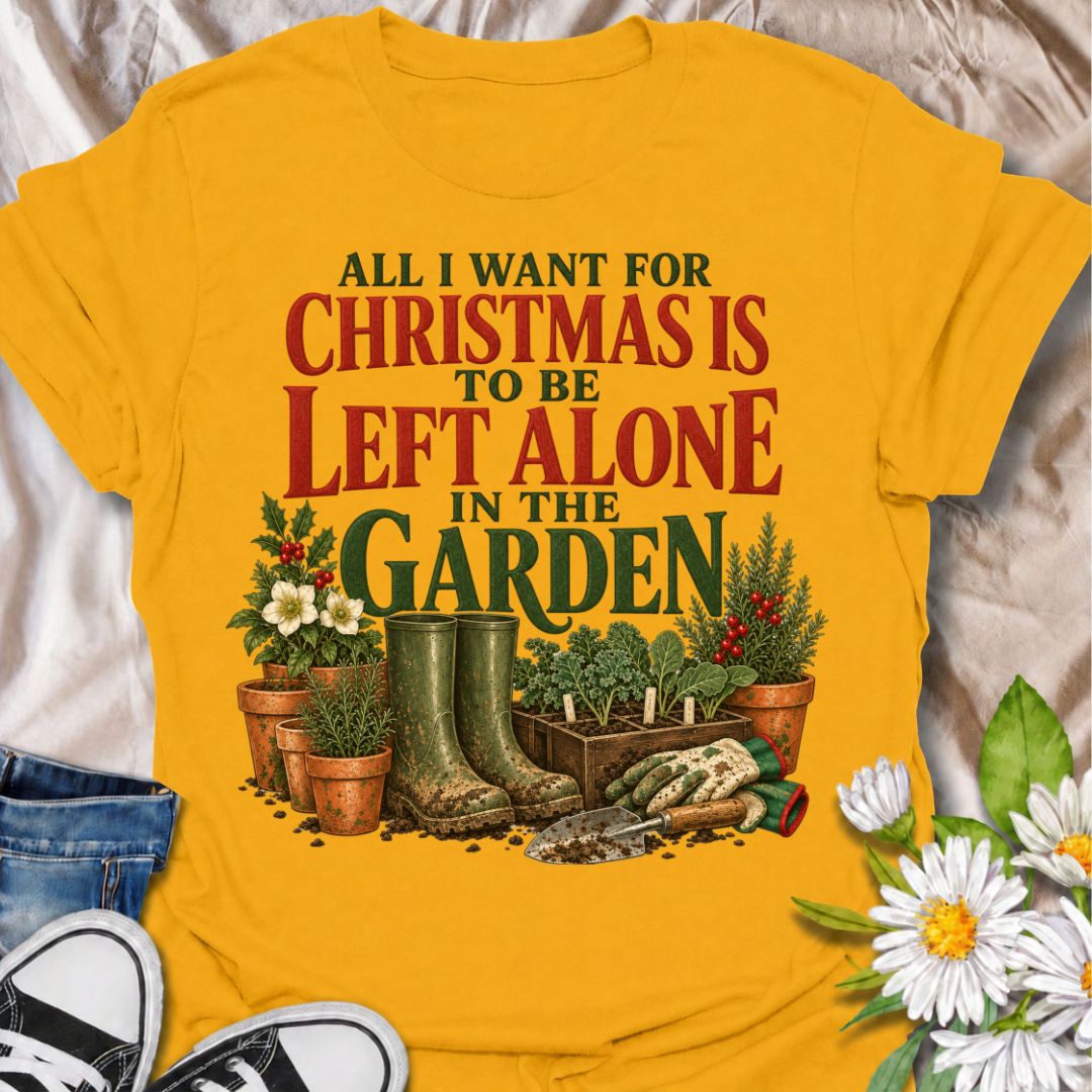 A funny Christmas gardening T-shirt for anyone whose perfect holiday involves escaping outside and being left alone with the plants. The phrase “All I Want for Christmas Is to Be Left Alone in the Garden” pairs with muddy wellies, gloves, a hand trowel, herbs, and festive holly for a design made especially for real gardeners. It is perfect for backyard gardeners, flower growers, vegetable gardeners, and anyone who would rather spend Christmas pottering outside than making small talk indoors. The vintage-sty