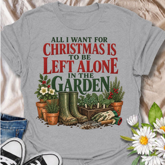A funny Christmas gardening T-shirt for anyone whose perfect holiday involves escaping outside and being left alone with the plants. The phrase “All I Want for Christmas Is to Be Left Alone in the Garden” pairs with muddy wellies, gloves, a hand trowel, herbs, and festive holly for a design made especially for real gardeners. It is perfect for backyard gardeners, flower growers, vegetable gardeners, and anyone who would rather spend Christmas pottering outside than making small talk indoors. The vintage-sty