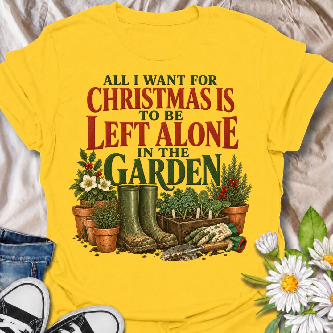 A funny Christmas gardening T-shirt for anyone whose perfect holiday involves escaping outside and being left alone with the plants. The phrase “All I Want for Christmas Is to Be Left Alone in the Garden” pairs with muddy wellies, gloves, a hand trowel, herbs, and festive holly for a design made especially for real gardeners. It is perfect for backyard gardeners, flower growers, vegetable gardeners, and anyone who would rather spend Christmas pottering outside than making small talk indoors. The vintage-sty