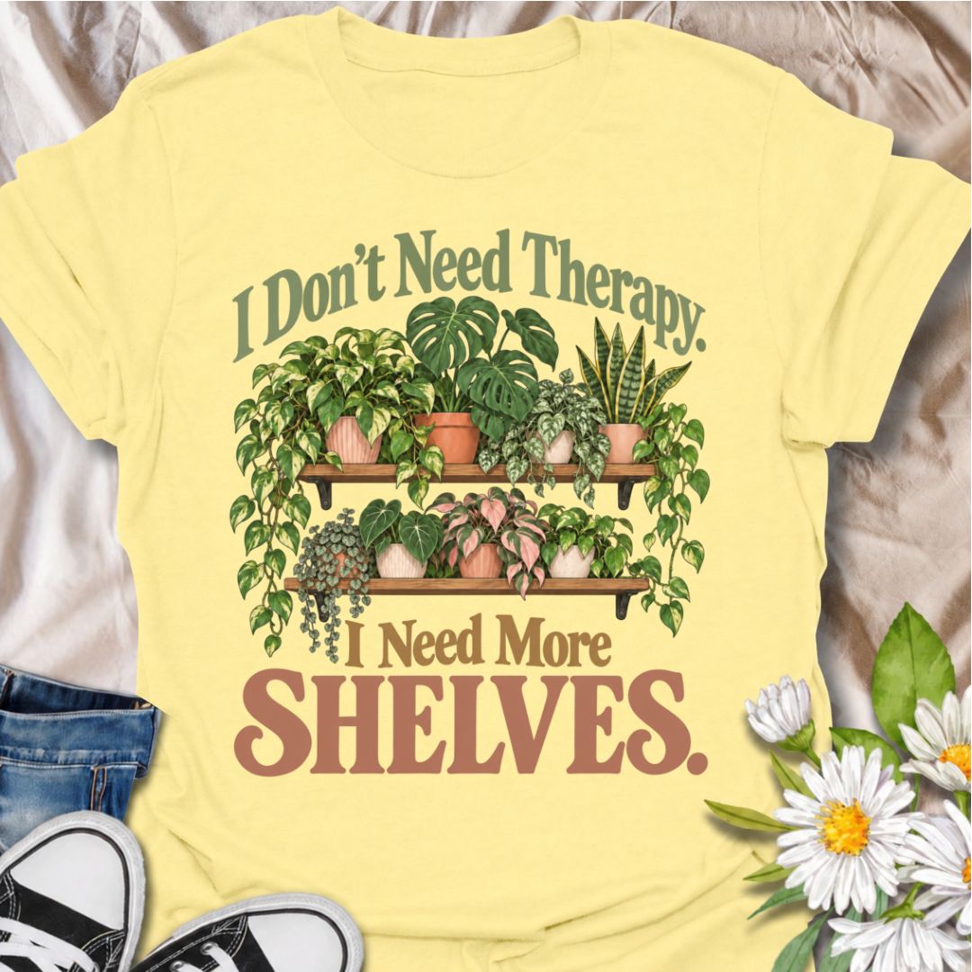 A funny houseplant T-shirt for anyone who has run out of room long before they have run out of plants. The phrase “I Don’t Need Therapy. I Need More Shelves.” pairs with overflowing plant shelves for a relatable houseplant-lover design with plenty of personality. It is perfect for plant parents, indoor gardeners, collectors, and anyone whose windowsills and surfaces are already completely occupied. The lush botanical artwork gives the design a fuller, more decorative look while keeping the joke easy to read