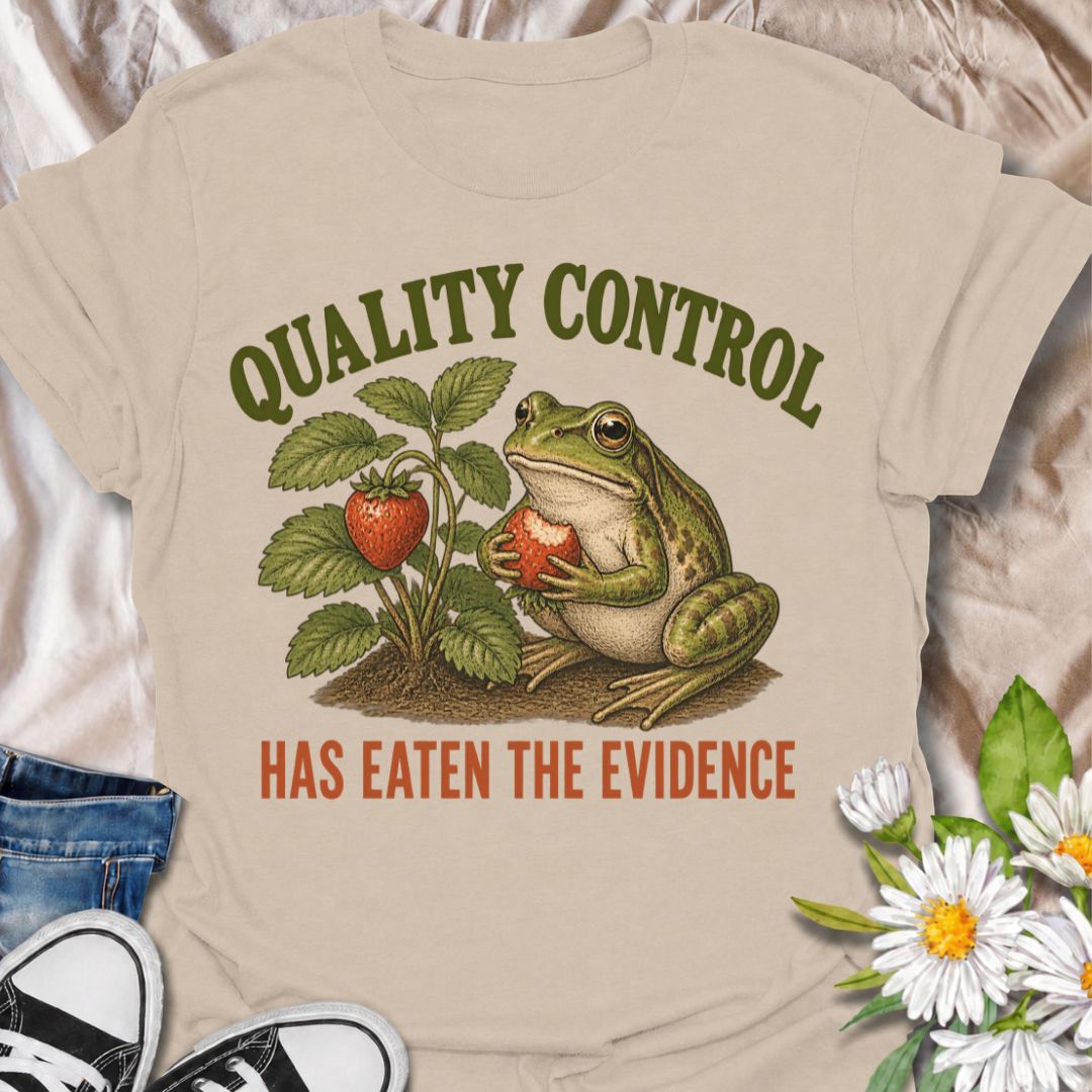 A funny gardening T-shirt for anyone who knows the garden’s unofficial quality-control inspector usually gets there first. The phrase “Quality Control Has Eaten the Evidence” pairs with a smug frog and strawberry plant for a playful, relatable take on garden wildlife. It is perfect for strawberry growers, backyard gardeners, frog lovers, and anyone who has lost part of the harvest before picking time. The vintage-style illustration gives the design plenty of character while keeping the joke clear and easy t