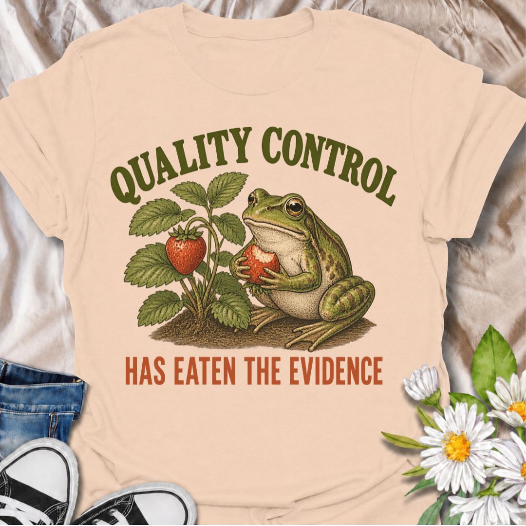 A funny gardening T-shirt for anyone who knows the garden’s unofficial quality-control inspector usually gets there first. The phrase “Quality Control Has Eaten the Evidence” pairs with a smug frog and strawberry plant for a playful, relatable take on garden wildlife. It is perfect for strawberry growers, backyard gardeners, frog lovers, and anyone who has lost part of the harvest before picking time. The vintage-style illustration gives the design plenty of character while keeping the joke clear and easy t