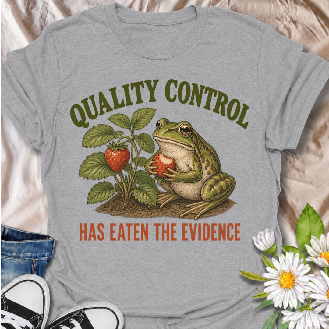 A funny gardening T-shirt for anyone who knows the garden’s unofficial quality-control inspector usually gets there first. The phrase “Quality Control Has Eaten the Evidence” pairs with a smug frog and strawberry plant for a playful, relatable take on garden wildlife. It is perfect for strawberry growers, backyard gardeners, frog lovers, and anyone who has lost part of the harvest before picking time. The vintage-style illustration gives the design plenty of character while keeping the joke clear and easy t