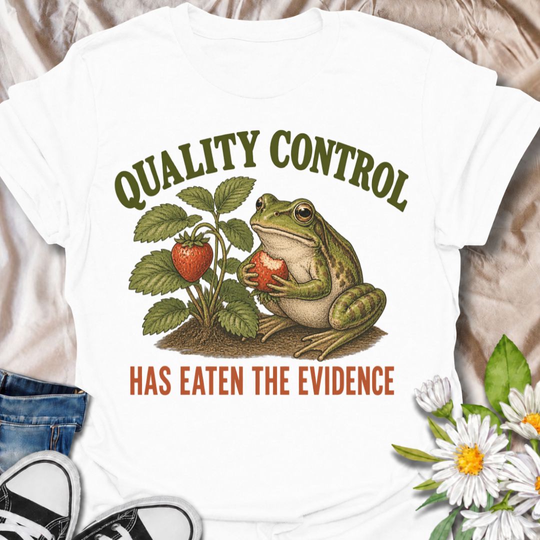A funny gardening T-shirt for anyone who knows the garden’s unofficial quality-control inspector usually gets there first. The phrase “Quality Control Has Eaten the Evidence” pairs with a smug frog and strawberry plant for a playful, relatable take on garden wildlife. It is perfect for strawberry growers, backyard gardeners, frog lovers, and anyone who has lost part of the harvest before picking time. The vintage-style illustration gives the design plenty of character while keeping the joke clear and easy t
