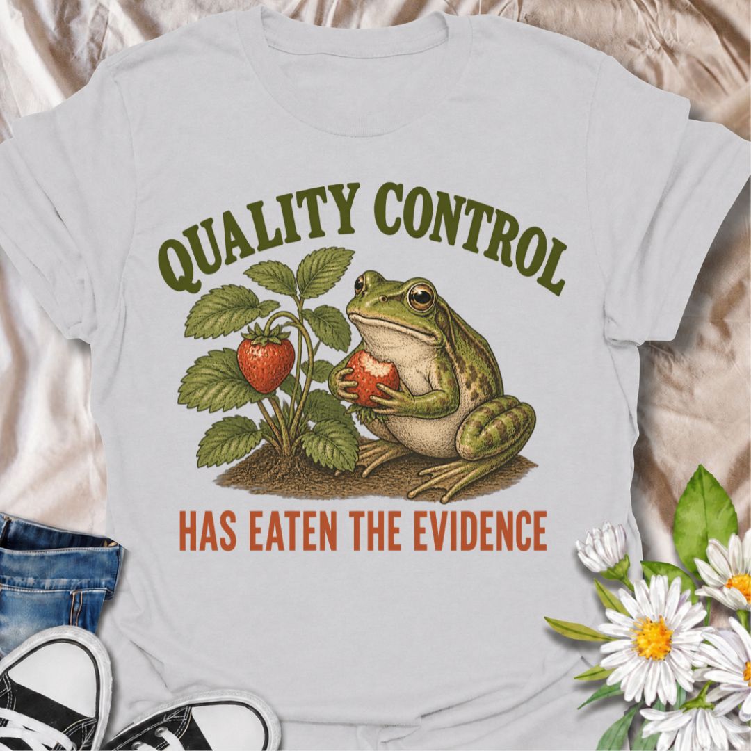 A funny gardening T-shirt for anyone who knows the garden’s unofficial quality-control inspector usually gets there first. The phrase “Quality Control Has Eaten the Evidence” pairs with a smug frog and strawberry plant for a playful, relatable take on garden wildlife. It is perfect for strawberry growers, backyard gardeners, frog lovers, and anyone who has lost part of the harvest before picking time. The vintage-style illustration gives the design plenty of character while keeping the joke clear and easy t