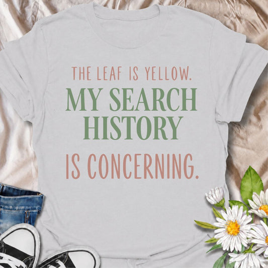 A funny houseplant T-shirt for anyone who sees one yellow leaf and immediately starts researching every possible cause. The phrase “The Leaf Is Yellow. My Search History Is Concerning.” captures the overthinking side of plant care with dry, relatable humor. It is perfect for plant parents, houseplant collectors, indoor gardeners, and anyone who has ever spiraled into searches about watering, light, pests, or root rot. The clean typography keeps the design simple, modern, and easy to wear. A great gift for h