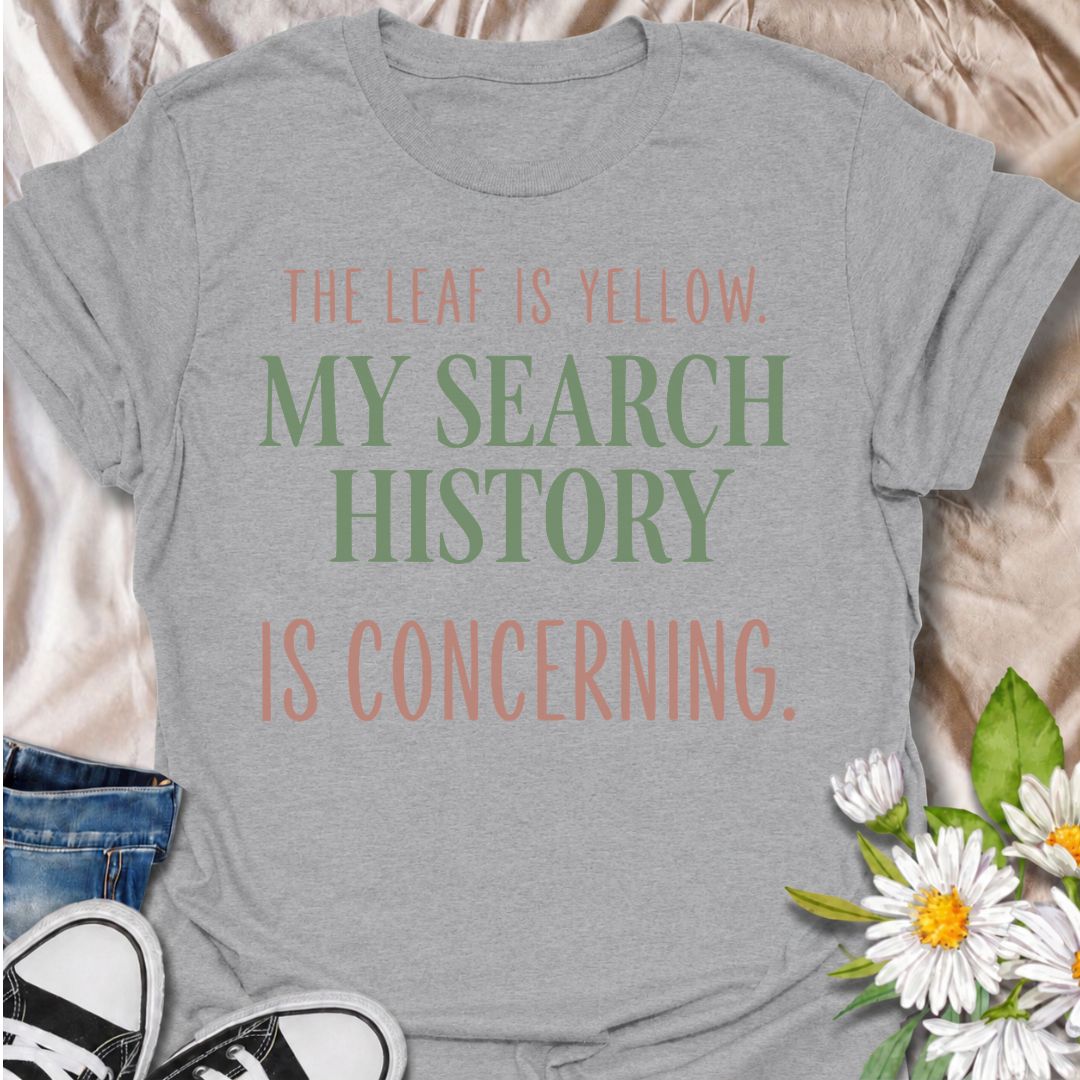 A funny houseplant T-shirt for anyone who sees one yellow leaf and immediately starts researching every possible cause. The phrase “The Leaf Is Yellow. My Search History Is Concerning.” captures the overthinking side of plant care with dry, relatable humor. It is perfect for plant parents, houseplant collectors, indoor gardeners, and anyone who has ever spiraled into searches about watering, light, pests, or root rot. The clean typography keeps the design simple, modern, and easy to wear. A great gift for h