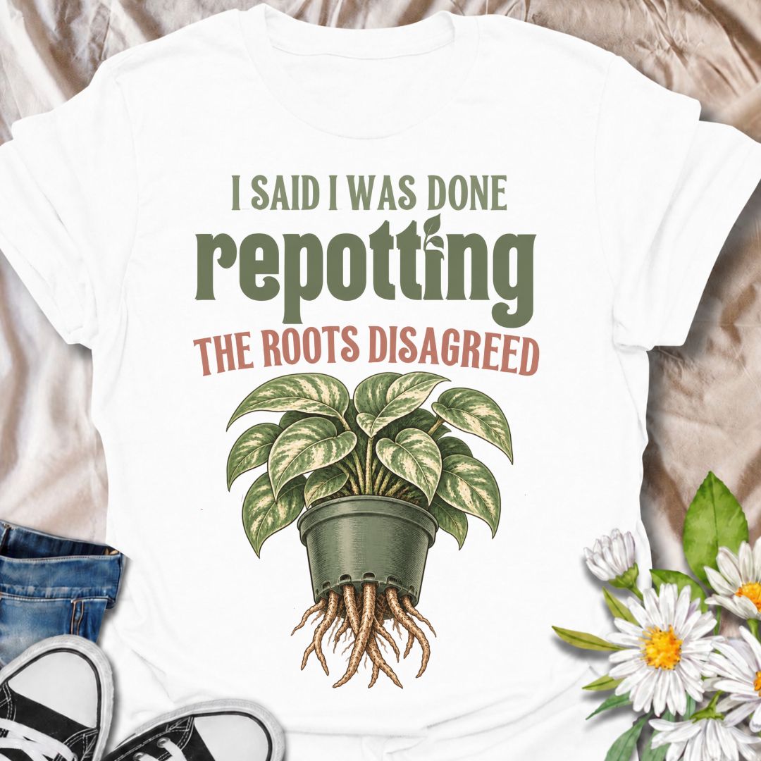 A funny houseplant T-shirt for anyone who thought they were finished repotting until the roots had other ideas. The phrase “I Said I Was Done Repotting. The Roots Disagreed.” captures one of those very familiar plant-parent problems with dry, relatable humor. Featuring a lush potted houseplant with roots pushing through the drainage holes, this design is perfect for indoor gardeners, plant collectors, and anyone constantly upsizing pots. It makes a great gift for pothos lovers, houseplant enthusiasts, and p