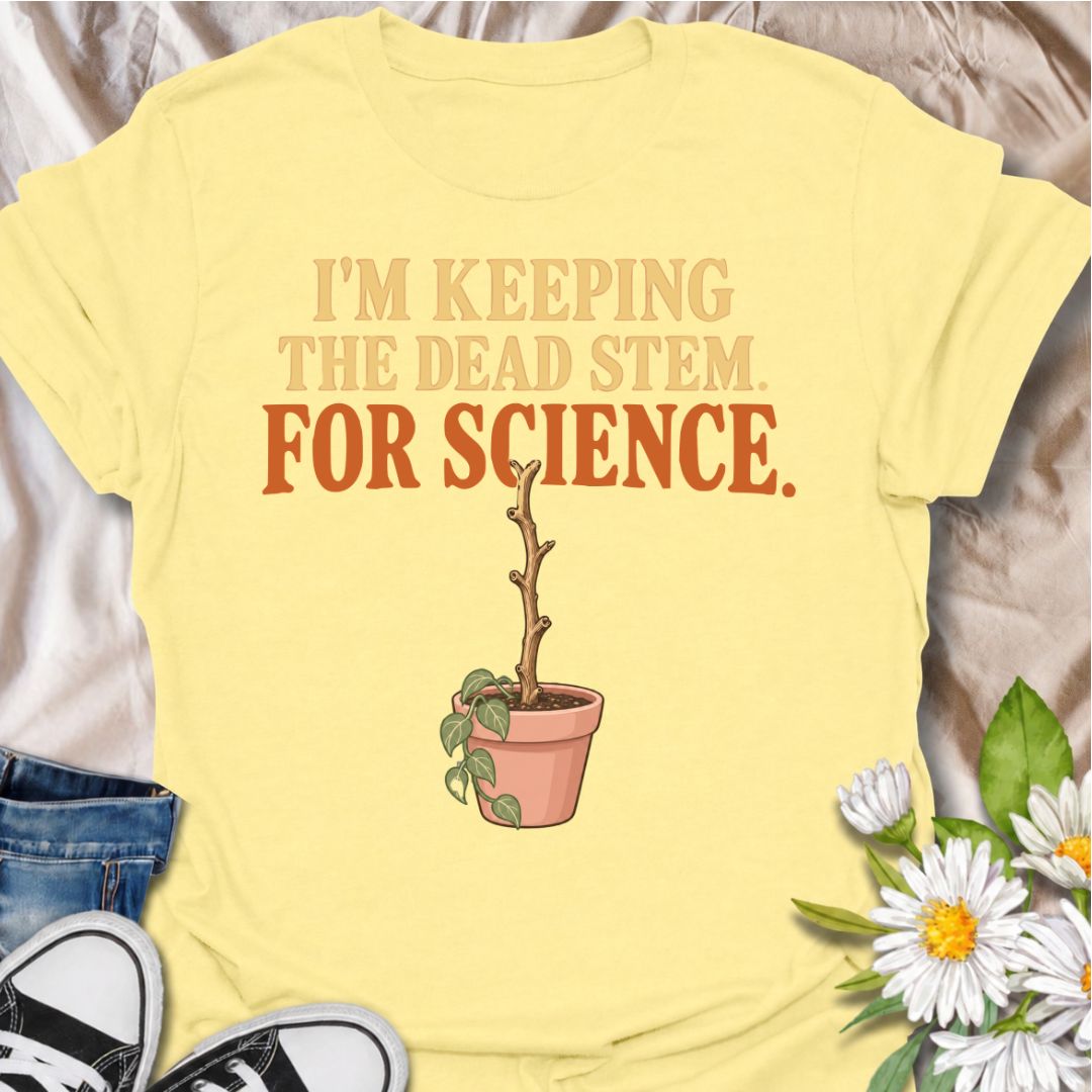 A funny houseplant T-shirt for anyone who keeps a questionable stem around “just in case” there is still some life left in it. The phrase “I’m Keeping the Dead Stem. For Science.” delivers dry, self-aware plant-parent humor that houseplant lovers will instantly understand. Featuring a sad little potted plant with one stubborn dead stem, the design is perfect for indoor gardeners, plant collectors, and anyone who has delayed giving up on a struggling plant. It makes a great gift for plant parents who overthi