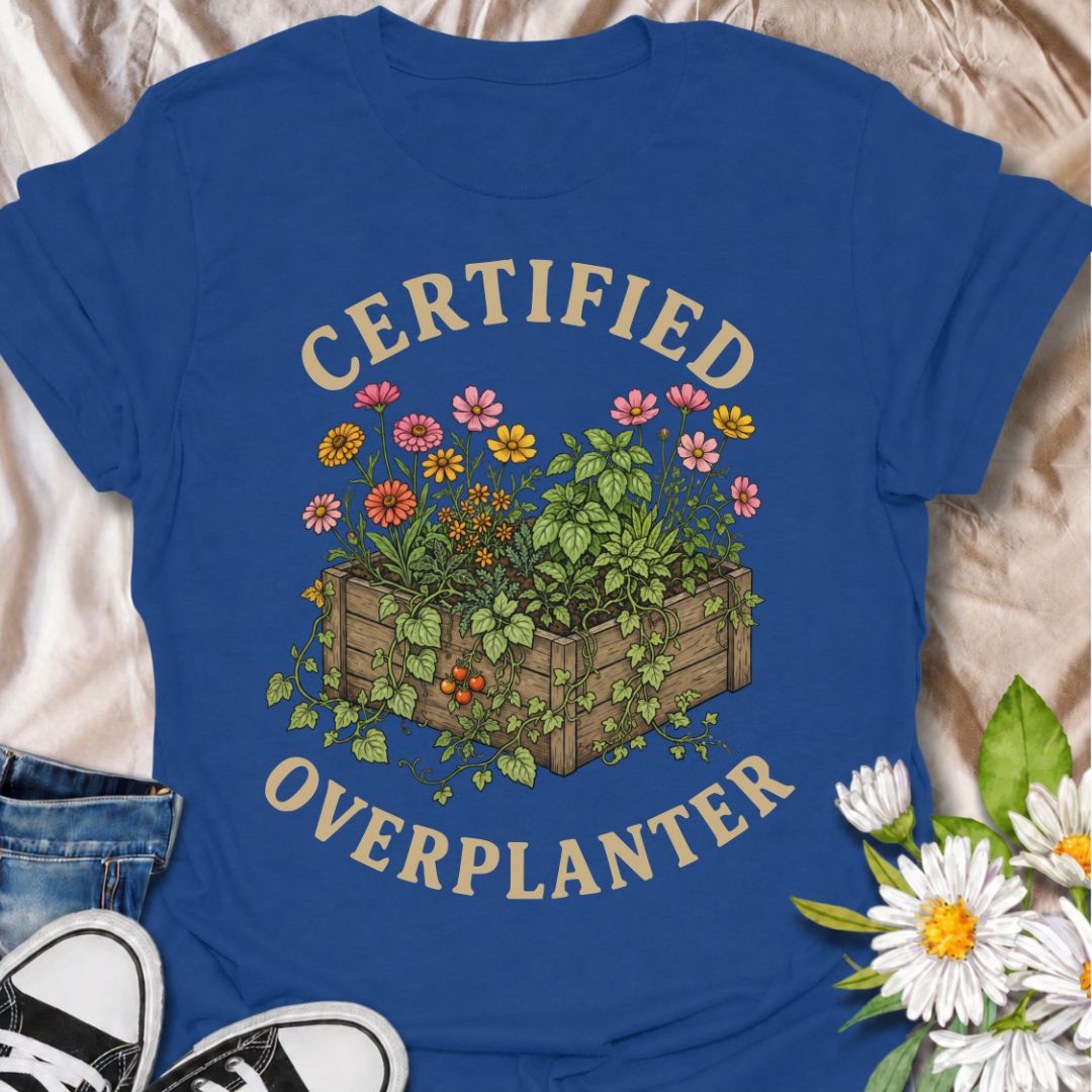 A funny gardening T-shirt for anyone who sees an empty patch of soil and immediately fills every inch of it. The “Certified Overplanter” phrase pairs with a packed raised bed overflowing with flowers, herbs, and vegetables for a design that real gardeners will instantly recognize. It is perfect for cottage gardeners, backyard growers, raised-bed gardeners, and anyone who treats recommended spacing as more of a suggestion than a rule. The vintage-style botanical artwork gives the design plenty of detail whil