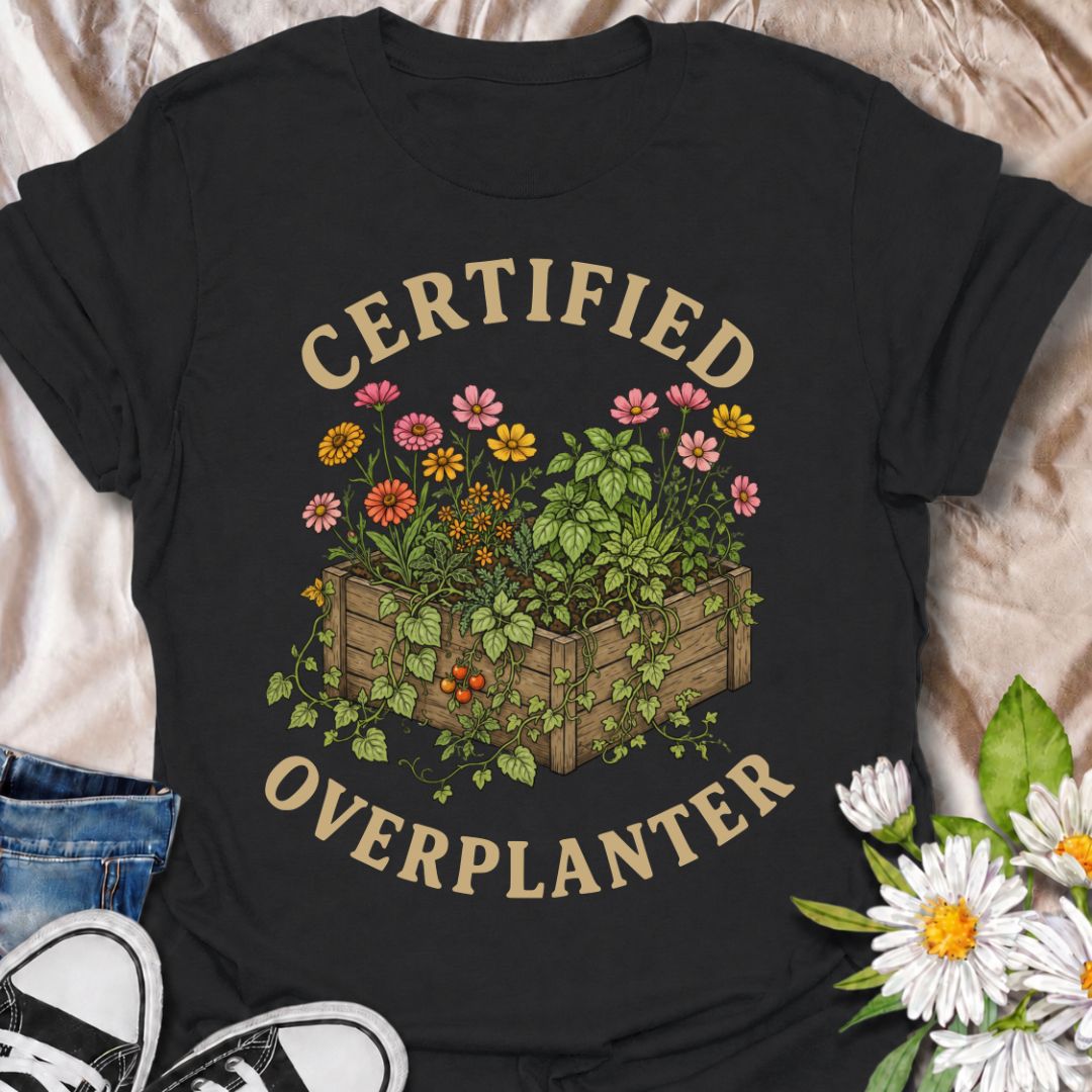 A funny gardening T-shirt for anyone who sees an empty patch of soil and immediately fills every inch of it. The “Certified Overplanter” phrase pairs with a packed raised bed overflowing with flowers, herbs, and vegetables for a design that real gardeners will instantly recognize. It is perfect for cottage gardeners, backyard growers, raised-bed gardeners, and anyone who treats recommended spacing as more of a suggestion than a rule. The vintage-style botanical artwork gives the design plenty of detail whil