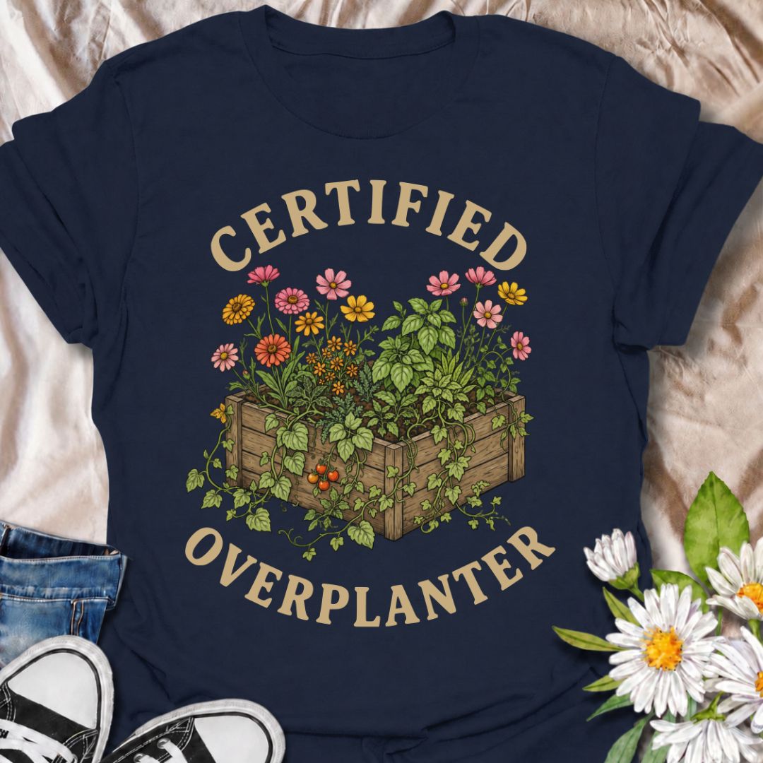 A funny gardening T-shirt for anyone who sees an empty patch of soil and immediately fills every inch of it. The “Certified Overplanter” phrase pairs with a packed raised bed overflowing with flowers, herbs, and vegetables for a design that real gardeners will instantly recognize. It is perfect for cottage gardeners, backyard growers, raised-bed gardeners, and anyone who treats recommended spacing as more of a suggestion than a rule. The vintage-style botanical artwork gives the design plenty of detail whil