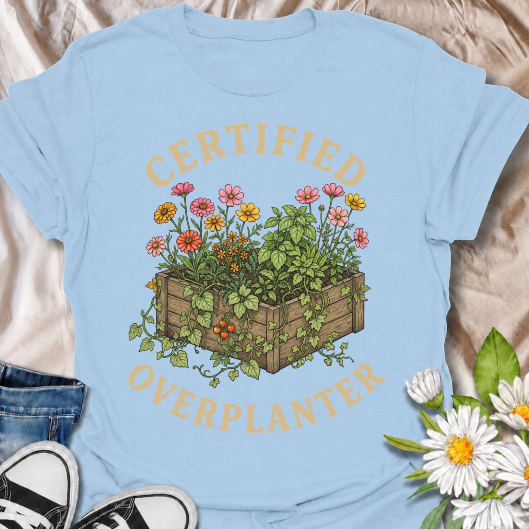 A funny gardening T-shirt for anyone who sees an empty patch of soil and immediately fills every inch of it. The “Certified Overplanter” phrase pairs with a packed raised bed overflowing with flowers, herbs, and vegetables for a design that real gardeners will instantly recognize. It is perfect for cottage gardeners, backyard growers, raised-bed gardeners, and anyone who treats recommended spacing as more of a suggestion than a rule. The vintage-style botanical artwork gives the design plenty of detail whil